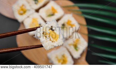Dessert Sushi. Sweet Kiwi, Pineapple Sushi Rolls. Sushi On A Wooden Tray On A Black Background. Hold