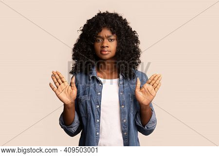 Irritated Young Black Woman Showing Stop Gesture With Both Palms Over Grey Studio Background, Copy S