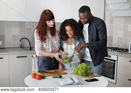 Healthy Eating, Parents Teach Kid To Cook, Weekend At Home Activity Concept. Family With Teen Daught