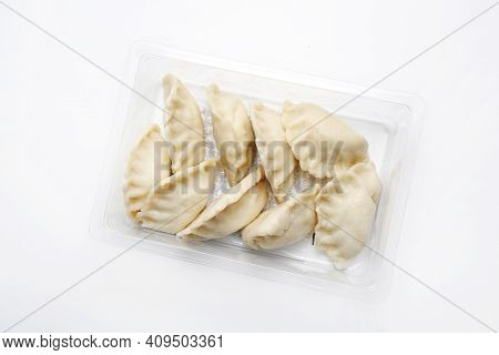 Top View Of Pierogi, Dumplings On A Plastic, Transparent Food Tray, Isolated On White.