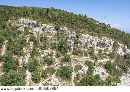 Aerial Drone View Of Hideout Of Titos Cave On Josip Broz On Vis Island In Croatia Summer