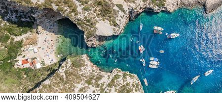 Aerial Panoramic Overhead Drone Shot Of Yachts At Adriatic Sea Tourists At Stiniva Beach On Vis Isla