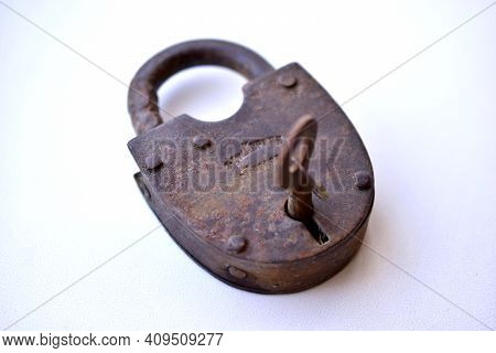 Old Curtain Padlock On A White Background
