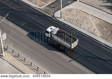 Truck With A Breakstone On A Road In The City During Road Construction Work.