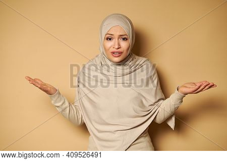 Young Beautiful Woman In Hijab Looks At The Camera Expressing Bewilderment, Surprise. Stylish Beauti