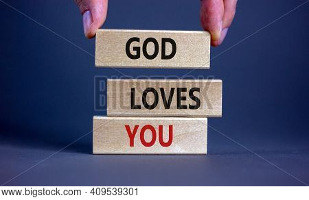 God Loves You Symbol. Concept Words 'god Loves You' On Wooden Blocks On A Beautiful Grey Background,