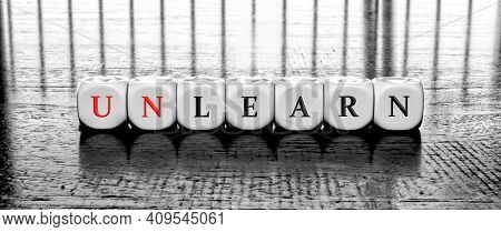 Banner With Word Learn Or Unlearn - Dilema Concept
