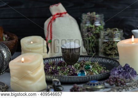 Magic Altar With Mystical Herbs, Salt, Candles And Crystals. Witch Sanctuary Sacred Esoteric Concept