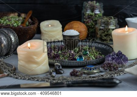 Magic Altar With Mystical Herbs, Salt, Candles And Crystals. Witch Sanctuary Sacred Esoteric Concept