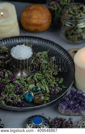 Magic Altar With Mystical Herbs, Salt, Candles And Crystals. Witch Sanctuary Sacred Esoteric Concept