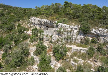 Aerial Drone View Of Hideout Of Titos Cave On Josip Broz On Vis Island In Croatia Summer