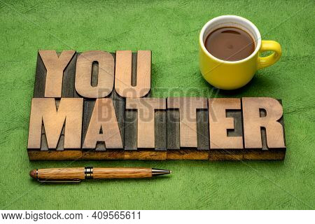 You matter reminder - inspirational word abstract in vintage letterpress wood type with a cup of coffee, positive affirmation, positiity and personal development concept