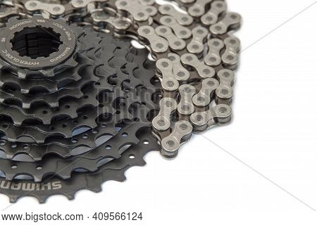 Krasnodar, Russia - February 12, 2021: New Shimano Bicycle Cassette And M-wave Chain Isolated On Whi