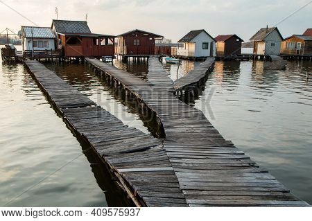 A Picture From Hungary, From A Place Called Bokod. The Local People Have The Wooden Cottages On Pylo