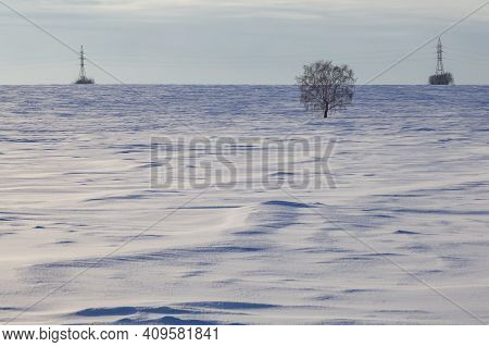 Power Line Poles Are Visible On The Horizon