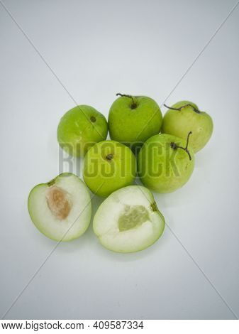 Indian Jujube Fruit Or Ziziphus Mauritiana Or Buah Bidara In A Rattan Bowl. Blurred Background