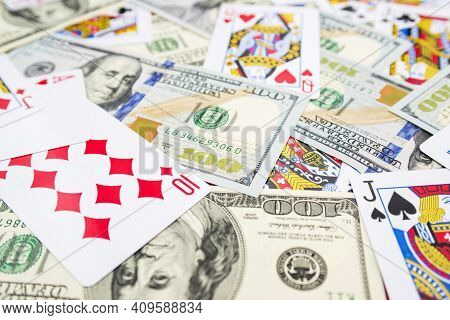 Playing Cards And Hundred-dollar Bills As A Background. Casino, Play Game, Gambling Concept. Game Ad