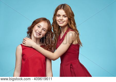 Cheerful Mom And Daughter Hugs Joy Lifestyle Communication Friendship Blue Background