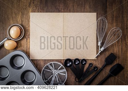 Bakery Background. Paper Craft Board, Egg Separator, Eggs, Non-stick Baking Tray, Stainless Steel Fl