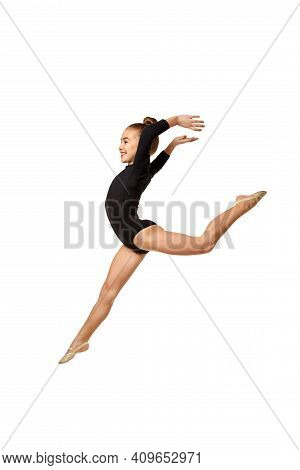 Young Flexible Slim Gymnast Girl In Gracefull Jump