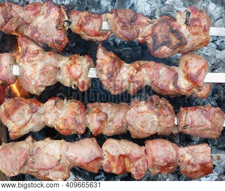 Delicious Grilled Pork Meat In Bbq Barbecue With Pork Meat. Kebabs On The Grill. Close-up Of Meat On