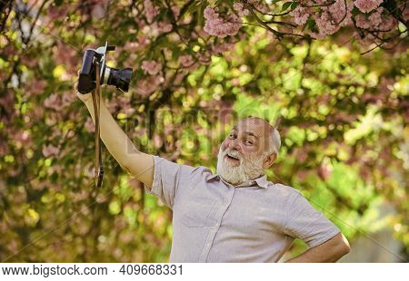 Self Portrait. Memories In Snap. Everyone Photogenic. Senior Man Taking Selfie Photo Vintage Camera.