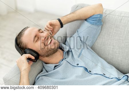 Attractive Man With Light Brown Hair And Beard, Singing His Favorite Song, Smiling, Listening Music 