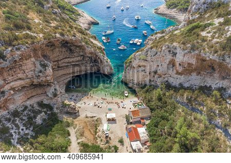 Aerial Drone Shot Of Iconic Stiniva Cove Beach Of Adriatic Sea On Vis Island In Croatia Summer