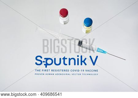 The Vaccine Sputnik V From The Coronovirus Infection Covid-19 And A Syringe On White Background. Jan