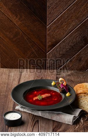 Ukrainian Traditional Borshch. Beetroot And Cabbage Soup With Meat Served With Sour Cream And Sliced