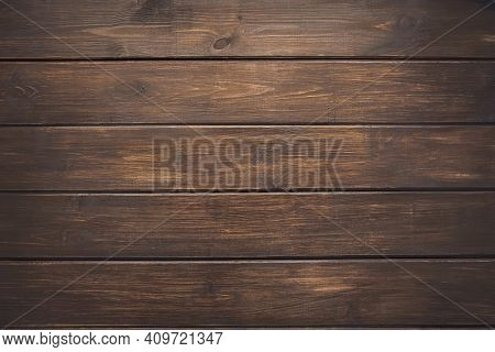 Dark Brown Wooden Vintage Plank Desk Table. Light Pattern  Background Of Timber Rough Surface Textur