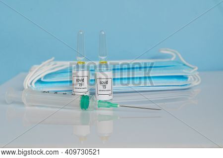 Vaccine, Maskas And Syringe, Prevention, Immunization And Treatment From Coronavirus Covid 19 Infect