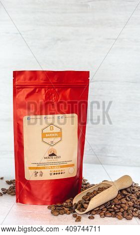 Tiraspol, Moldova - February, 12, 2021 Red Coffee Bag With Degassing Valve. Coffee Beans 100% Arabic