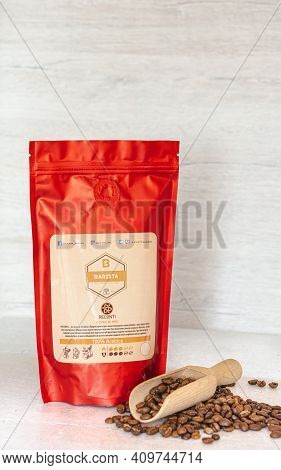 Tiraspol, Moldova - February, 12, 2021 Red Coffee Bag With Degassing Valve. Coffee Beans 100% Arabic