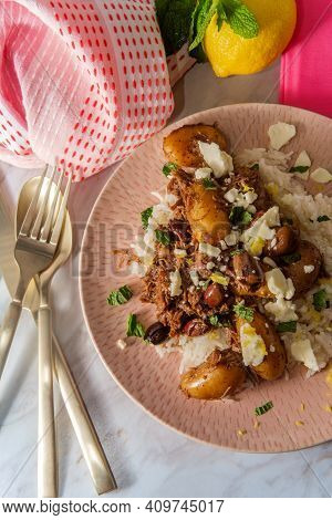 Greek Shredded Lamb Stew Marinated In A White Wine Salmoriglio Sauce With New Potatoes Kalamata Oliv