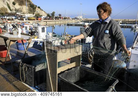 Numana (an), Italy - January 1, 2019: Fisherman At  Numana Port, Riviera Del Conero, Adriatic Sea, N