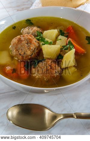 Russian Frikadeller Meatball Soup With Potatoes And Parsley Garnish