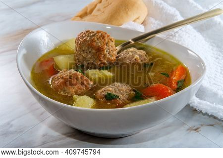 Russian Frikadeller Meatball Soup With Potatoes And Parsley Garnish