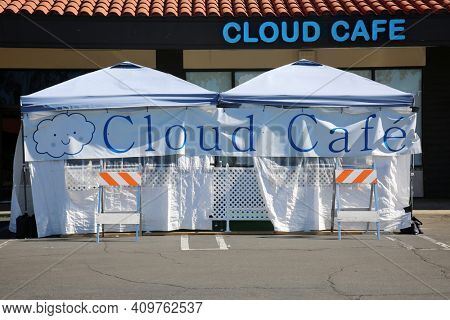 Lake Forest, California - USA - February 22, 2021: Outdoor Restaurant Dining. Restaurants are forced to set up outside tents and enclosures for dining due to the Coronavirus Pandemic Restrictions.  
