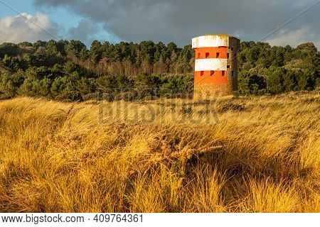 Saint Brelade British Round Coastal Defence Tower Standing In The Field, Bailiwick Of Jersey, Channe