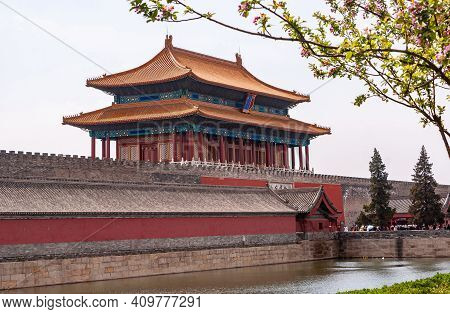 Beijing, China - April 27, 2010: Moat, Ramparts, And Red Gate Of Divine Prowess Building As Exit Of 