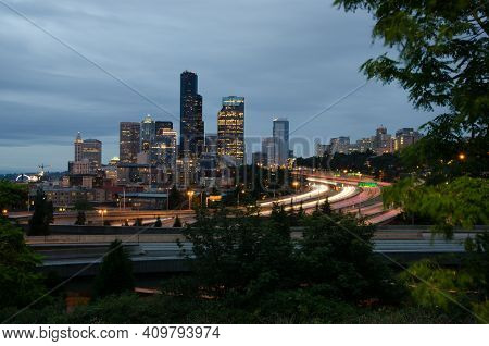 Seattle Skyline Cityscape With Light Trails And Traffic