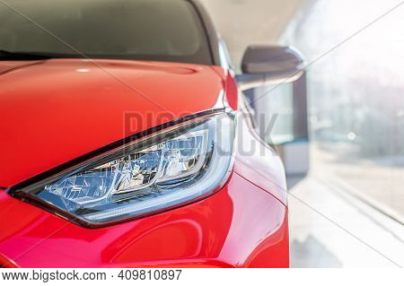 Red Car Headlight Close Up In The Car Interior.