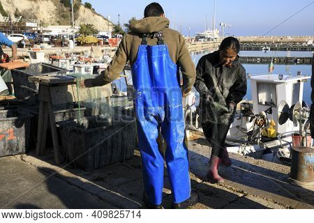 Numana (an), Italy - January 1, 2019: Fisherman At  Numana Port, Riviera Del Conero, Adriatic Sea, N