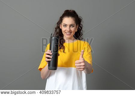 Teenager Holding Eco Reusable Smart Thermo Water Bottle With Drink Reminder, Health Care Concept