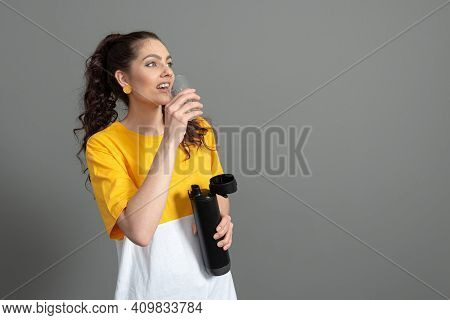 Teenager Holding Eco Reusable Smart Thermo Water Bottle With Drink Reminder, Health Care Concept