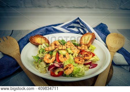 Fried Shrimps With Herbs And Sices On Fresh Salad