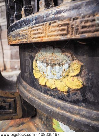 Blooming Lotus Flower On An Ancient Black Metal Incense Burner In A Chinese Temple