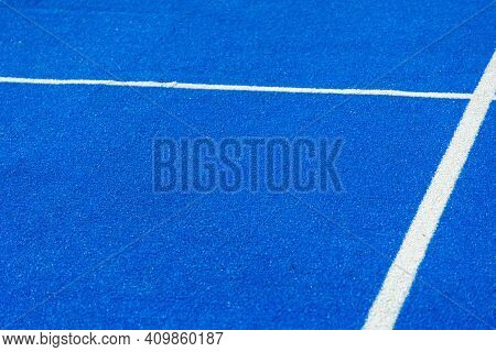 Bright Blue Tennis, Paddle Ball Or Pickleball Court Close Up Of Service Line Outdoors.