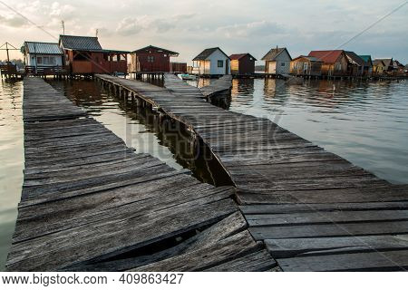 A Picture From Hungary, From A Place Called Bokod. The Local People Have The Wooden Cottages On Pylo